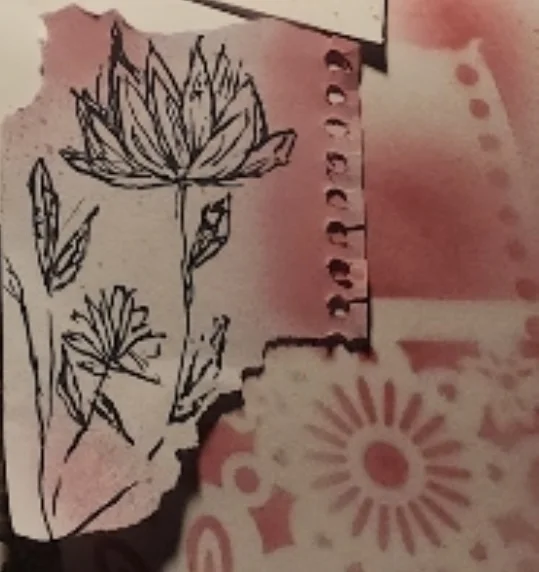 Black ink lotus drawing on torn pink paper beside a stencilled sun