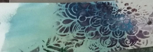 Teal and plum stencilled flower pattern on paper